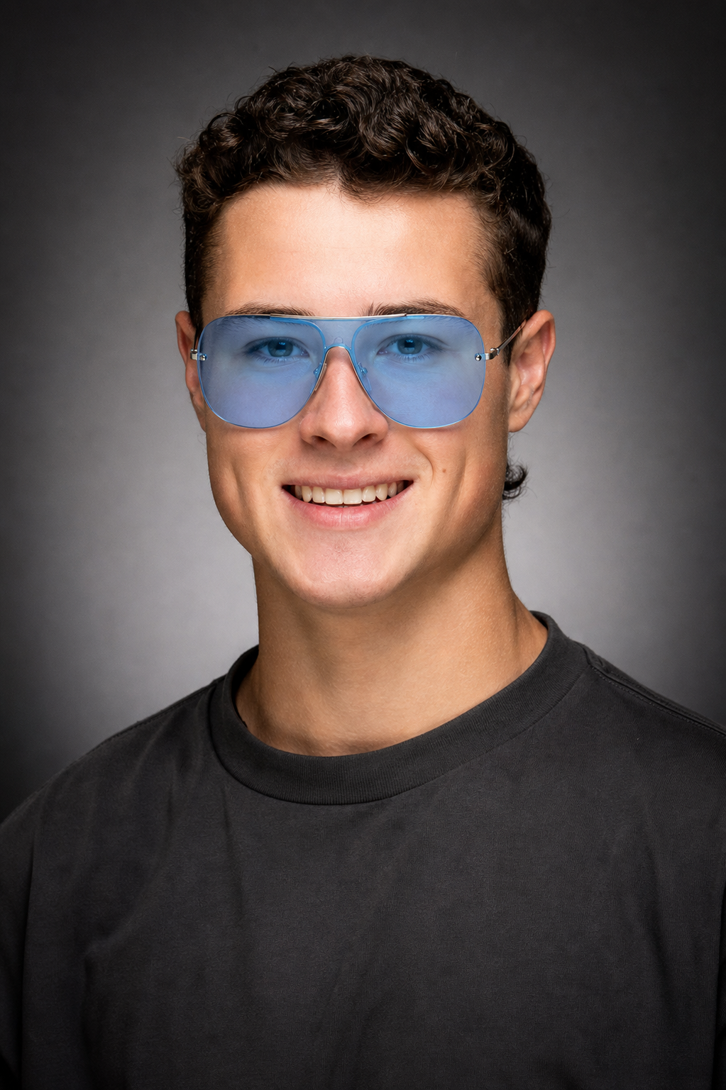 Titan, founder of HUDDYS, wearing a pair of HUDDYS sunglasses